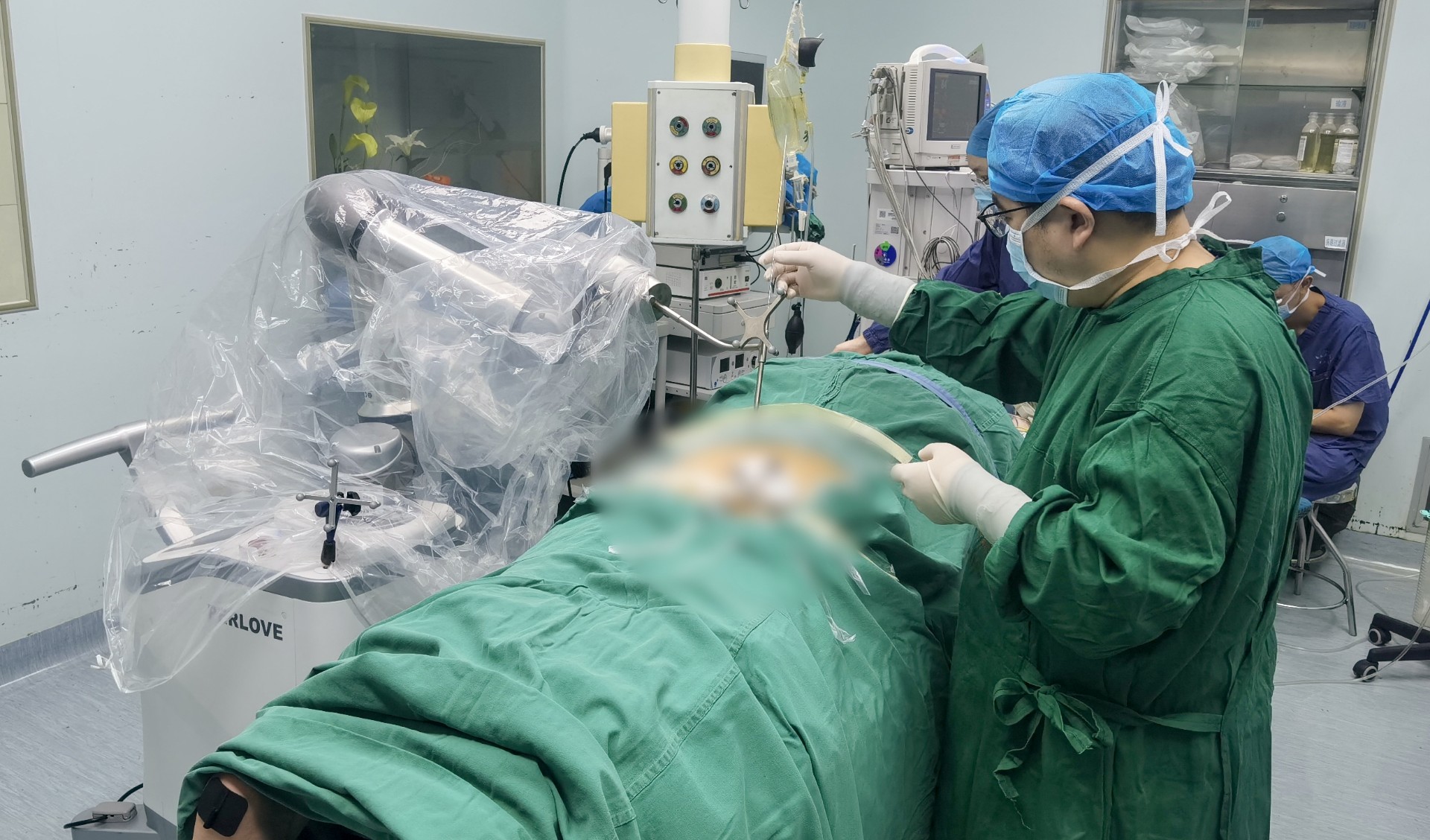 Orthopedic surgical robot assists in sacral nerve stimulator implantation.